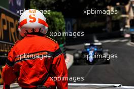 A marshal watches Fernando Alonso (ESP) Alpine F1 Team A521. 20.05.2021. Formula 1 World Championship, Rd 5, Monaco Grand Prix, Monte Carlo, Monaco, Practice Day.