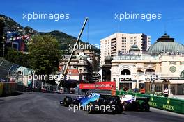 George Russell (GBR) Williams Racing FW43B and Mick Schumacher (GER) Haas VF-21. 20.05.2021. Formula 1 World Championship, Rd 5, Monaco Grand Prix, Monte Carlo, Monaco, Practice Day.