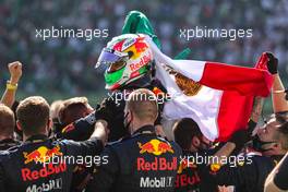 Sergio Perez (MEX) Red Bull Racing celebrates his third position with the team in parc ferme. 07.11.2021. Formula 1 World Championship, Rd 18, Mexican Grand Prix, Mexico City, Mexico, Race Day.