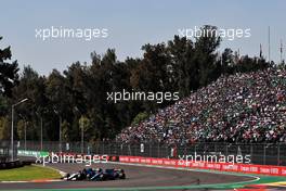 George Russell (GBR) Williams Racing FW43B and Fernando Alonso (ESP) Alpine F1 Team A521 battle for position. 07.11.2021. Formula 1 World Championship, Rd 18, Mexican Grand Prix, Mexico City, Mexico, Race Day.