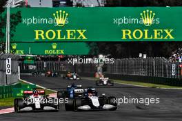 Kimi Raikkonen (FIN) Alfa Romeo Racing C41 and George Russell (GBR) Williams Racing FW43B battle for position. 07.11.2021. Formula 1 World Championship, Rd 18, Mexican Grand Prix, Mexico City, Mexico, Race Day.