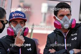 (L to R): Fernando Alonso (ESP) Alpine F1 Team and Esteban Ocon (FRA) Alpine F1 Team - Pantone spray painting. 07.11.2021. Formula 1 World Championship, Rd 18, Mexican Grand Prix, Mexico City, Mexico, Race Day.