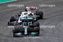 Lewis Hamilton (GBR) Mercedes AMG F1 W12 leads Mick Schumacher (GER) Haas VF-21. 30.04.2021. Formula 1 World Championship, Rd 3, Portuguese Grand Prix, Portimao, Portugal, Practice Day.