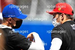 Mick Schumacher (GER) Haas F1 Team with Charles Leclerc (MON) Ferrari on the grid. 02.05.2021. Formula 1 World Championship, Rd 3, Portuguese Grand Prix, Portimao, Portugal, Race Day.