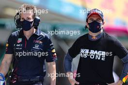 Sergio Perez (MEX) Red Bull Racing on the grid with Xavi Martos (ESP) Aston Martin F1 Team Physio. 02.05.2021. Formula 1 World Championship, Rd 3, Portuguese Grand Prix, Portimao, Portugal, Race Day.