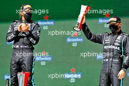 Valtteri Bottas (FIN) Mercedes AMG F1 celebrates his third position on the podium (Right) with race winner Lewis Hamilton (GBR) Mercedes AMG F1 (Left). 02.05.2021. Formula 1 World Championship, Rd 3, Portuguese Grand Prix, Portimao, Portugal, Race Day.