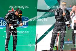 (L to R): Race winner Lewis Hamilton (GBR) Mercedes AMG F1 celebrates on the podium with third placed team mate Valtteri Bottas (FIN) Mercedes AMG F1. 02.05.2021. Formula 1 World Championship, Rd 3, Portuguese Grand Prix, Portimao, Portugal, Race Day.