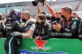 Race winner Lewis Hamilton (GBR) Mercedes AMG F1 celebrates with the team in parc ferme. 02.05.2021. Formula 1 World Championship, Rd 3, Portuguese Grand Prix, Portimao, Portugal, Race Day.