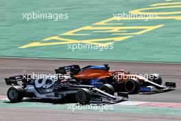 Pierre Gasly (FRA) AlphaTauri AT02 and Daniel Ricciardo (AUS) McLaren MCL35M battle for position. 02.05.2021. Formula 1 World Championship, Rd 3, Portuguese Grand Prix, Portimao, Portugal, Race Day.
