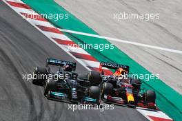 (L to R): Lewis Hamilton (GBR) Mercedes AMG F1 W12 and Max Verstappen (NLD) Red Bull Racing RB16B battle for position. 02.05.2021. Formula 1 World Championship, Rd 3, Portuguese Grand Prix, Portimao, Portugal, Race Day.