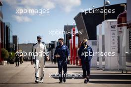 (L to R): George Russell (GBR) Williams Racing with Adam McDaid (GBR) Williams Racing Social Media Manager and Eve Merrell (GBR) Williams Racing Junior Press Officer. 01.05.2021. Formula 1 World Championship, Rd 3, Portuguese Grand Prix, Portimao, Portugal, Qualifying Day.