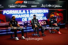(L to R): Lewis Hamilton (GBR) Mercedes AMG F1; Valtteri Bottas (FIN) Mercedes AMG F1; and Max Verstappen (NLD) Red Bull Racing, in the post qualifying FIA Press Conference. 01.05.2021. Formula 1 World Championship, Rd 3, Portuguese Grand Prix, Portimao, Portugal, Qualifying Day.