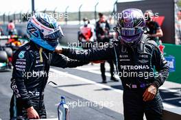 (L to R): Valtteri Bottas (FIN) Mercedes AMG F1 celebrates his pole position in qualifying parc ferme with second placed team mate Lewis Hamilton (GBR) Mercedes AMG F1. 01.05.2021. Formula 1 World Championship, Rd 3, Portuguese Grand Prix, Portimao, Portugal, Qualifying Day.