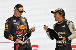 Fernando Alonso (ESP) Alpine F1 Team (Right) celebrates his third position on the podium with second placed Max Verstappen (NLD) Red Bull Racing. 21.11.2021. Formula 1 World Championship, Rd 20, Qatar Grand Prix, Doha, Qatar, Race Day.