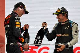 (L to R): Max Verstappen (NLD) Red Bull Racing celebrates his second position with third placed Fernando Alonso (ESP) Alpine F1 Team on the podium. 21.11.2021. Formula 1 World Championship, Rd 20, Qatar Grand Prix, Doha, Qatar, Race Day.
