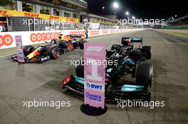 Race winner Lewis Hamilton (GBR) Mercedes AMG F1 W12 and second placed Max Verstappen (NLD) Red Bull Racing RB16B in parc ferme. 21.11.2021. Formula 1 World Championship, Rd 20, Qatar Grand Prix, Doha, Qatar, Race Day.