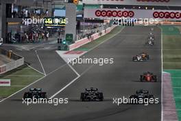 (L to R): Valtteri Bottas (FIN) Mercedes AMG F1 W12, Yuki Tsunoda (JPN) AlphaTauri AT02, and Lance Stroll (CDN) Aston Martin F1 Team AMR21, battle for position. 21.11.2021. Formula 1 World Championship, Rd 20, Qatar Grand Prix, Doha, Qatar, Race Day.