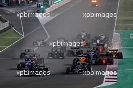 Lewis Hamilton (GBR) Mercedes AMG F1 W12 leads Pierre Gasly (FRA) AlphaTauri AT02 at the start of the race. 21.11.2021. Formula 1 World Championship, Rd 20, Qatar Grand Prix, Doha, Qatar, Race Day.