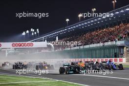 Lewis Hamilton (GBR) Mercedes AMG F1 W12 leads Pierre Gasly (FRA) AlphaTauri AT02 and Fernando Alonso (ESP) Alpine F1 Team A521 at the start of the race. 21.11.2021. Formula 1 World Championship, Rd 20, Qatar Grand Prix, Doha, Qatar, Race Day.