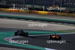Daniel Ricciardo (AUS) McLaren MCL35M and Sebastian Vettel (GER) Aston Martin F1 Team AMR21 battle for position. 21.11.2021. Formula 1 World Championship, Rd 20, Qatar Grand Prix, Doha, Qatar, Race Day.