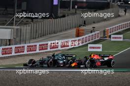 Sebastian Vettel (GER) Aston Martin F1 Team AMR21 and Sergio Perez (MEX) Red Bull Racing RB16B battle for position. 21.11.2021. Formula 1 World Championship, Rd 20, Qatar Grand Prix, Doha, Qatar, Race Day.