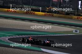 Fernando Alonso (ESP) Alpine F1 Team A521 and Sergio Perez (MEX) Red Bull Racing RB16B battle for position. 21.11.2021. Formula 1 World Championship, Rd 20, Qatar Grand Prix, Doha, Qatar, Race Day.