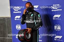 Lewis Hamilton (GBR) Mercedes AMG F1 celebrates his with the Pirelli Pole Position Award in qualifying parc ferme. 20.11.2021. Formula 1 World Championship, Rd 20, Qatar Grand Prix, Doha, Qatar, Qualifying Day.