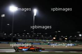 Lando Norris (GBR) McLaren MCL35M and Charles Leclerc (MON) Ferrari SF-21. 20.11.2021. Formula 1 World Championship, Rd 20, Qatar Grand Prix, Doha, Qatar, Qualifying Day.