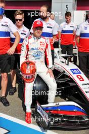 Nikita Mazepin (RUS) Haas F1 Team VF-21 at a team photograph. 21.11.2021. Formula 1 World Championship, Rd 20, Qatar Grand Prix, Doha, Qatar, Race Day.