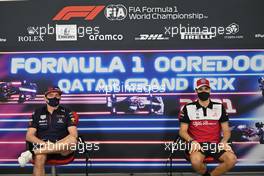 (L to R): Max Verstappen (NLD) Red Bull Racing and Antonio Giovinazzi (ITA) Alfa Romeo Racing in the FIA Press Conference. 18.11.2021. Formula 1 World Championship, Rd 20, Qatar Grand Prix, Doha, Qatar, Preparation Day.
