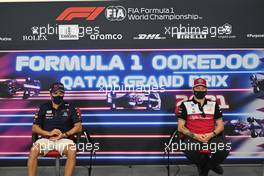(L to R): Sergio Perez (MEX) Red Bull Racing and Kimi Raikkonen (FIN) Alfa Romeo Racing in the FIA Press Conference. 18.11.2021. Formula 1 World Championship, Rd 20, Qatar Grand Prix, Doha, Qatar, Preparation Day.