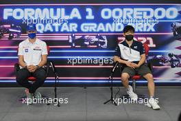 Mick Schumacher (GER) Haas F1 Team and Yuki Tsunoda (JPN) AlphaTauri in the FIA Press Conference. 18.11.2021. Formula 1 World Championship, Rd 20, Qatar Grand Prix, Doha, Qatar, Preparation Day.