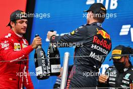 (L to R): Carlos Sainz Jr (ESP) Ferrari celebrates his third position on the podium with second placed Max Verstappen (NLD) Red Bull Racing. 26.09.2021. Formula 1 World Championship, Rd 15, Russian Grand Prix, Sochi Autodrom, Sochi, Russia, Race Day.