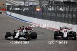 Antonio Giovinazzi (ITA) Alfa Romeo Racing C41 and Nikita Mazepin (RUS) Haas F1 Team VF-21 battle for position. 26.09.2021. Formula 1 World Championship, Rd 15, Russian Grand Prix, Sochi Autodrom, Sochi, Russia, Race Day.