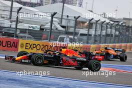 Lando Norris (GBR) McLaren MCL35M heads into the pits as Max Verstappen (NLD) Red Bull Racing RB16B passes him. 26.09.2021. Formula 1 World Championship, Rd 15, Russian Grand Prix, Sochi Autodrom, Sochi, Russia, Race Day.