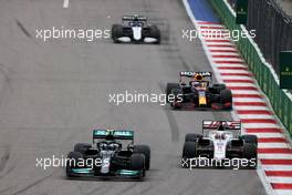 Valtteri Bottas (FIN) Mercedes AMG F1 W12 and Nikita Mazepin (RUS) Haas F1 Team VF-21 battle for position. 26.09.2021. Formula 1 World Championship, Rd 15, Russian Grand Prix, Sochi Autodrom, Sochi, Russia, Race Day.