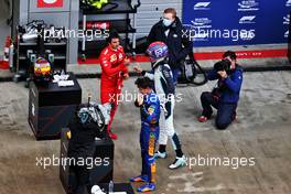Pole sitter Lando Norris (GBR) McLaren in qualifying parc ferme with second placed Carlos Sainz Jr (ESP) Ferrari and third placed George Russell (GBR) Williams Racing. 25.09.2021. Formula 1 World Championship, Rd 15, Russian Grand Prix, Sochi Autodrom, Sochi, Russia, Qualifying Day.