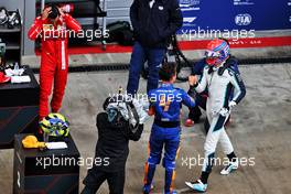 Lando Norris (GBR) McLaren celebrates his pole position in qualifying parc ferme with third placed George Russell (GBR) Williams Racing. 25.09.2021. Formula 1 World Championship, Rd 15, Russian Grand Prix, Sochi Autodrom, Sochi, Russia, Qualifying Day.