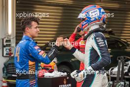 (L to R): Pole sitter Lando Norris (GBR) McLaren celebrates with third placed George Russell (GBR) Williams Racing in qualifying parc ferme. 25.09.2021. Formula 1 World Championship, Rd 15, Russian Grand Prix, Sochi Autodrom, Sochi, Russia, Qualifying Day.