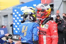 Lando Norris (GBR) McLaren MCL35M and Carlos Sainz Jr (ESP) Ferrari SF-21. 25.09.2021. Formula 1 World Championship, Rd 15, Russian Grand Prix, Sochi Autodrom, Sochi, Russia, Qualifying Day.