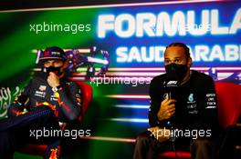 Lewis Hamilton (GBR) Mercedes AMG F1 and Max Verstappen (NLD) Red Bull Racing in the post race FIA Press Conference. 05.12.2021. Formula 1 World Championship, Rd 21, Saudi Arabian Grand Prix, Jeddah, Saudi Arabia, Race Day.