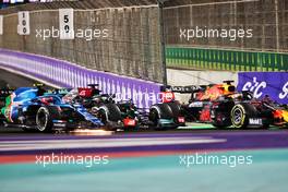 (L to R): Esteban Ocon (FRA) Alpine F1 Team A521; Lewis Hamilton (GBR) Mercedes AMG F1 W12; and Max Verstappen (NLD) Red Bull Racing RB16B battle for the lead at the second race restart. 05.12.2021. Formula 1 World Championship, Rd 21, Saudi Arabian Grand Prix, Jeddah, Saudi Arabia, Race Day.