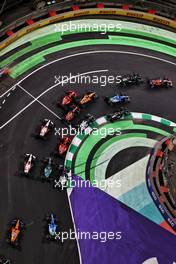 Max Verstappen (NLD) Red Bull Racing RB16B and Lewis Hamilton (GBR) Mercedes AMG F1 W12 battle for the lead at the restart of the race. 05.12.2021. Formula 1 World Championship, Rd 21, Saudi Arabian Grand Prix, Jeddah, Saudi Arabia, Race Day.