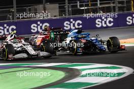 (L to R): Antonio Giovinazzi (ITA) Alfa Romeo Racing C41 and Fernando Alonso (ESP) Alpine F1 Team A521 battle for position. 05.12.2021. Formula 1 World Championship, Rd 21, Saudi Arabian Grand Prix, Jeddah, Saudi Arabia, Race Day.