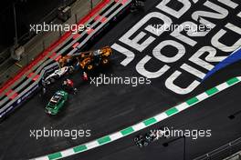 Lewis Hamilton (GBR) Mercedes AMG F1 W12 passes the crashed Haas VF-21 of Mick Schumacher (GER) Haas VF-21. 05.12.2021. Formula 1 World Championship, Rd 21, Saudi Arabian Grand Prix, Jeddah, Saudi Arabia, Race Day.