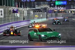 Max Verstappen (NLD) Red Bull Racing RB16B leads behind the Aston Martin FIA Safety Car. 05.12.2021. Formula 1 World Championship, Rd 21, Saudi Arabian Grand Prix, Jeddah, Saudi Arabia, Race Day.