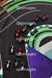 Max Verstappen (NLD) Red Bull Racing RB16B and Lewis Hamilton (GBR) Mercedes AMG F1 W12 battle for the lead at the restart of the race. 05.12.2021. Formula 1 World Championship, Rd 21, Saudi Arabian Grand Prix, Jeddah, Saudi Arabia, Race Day.