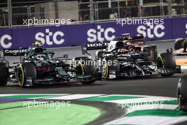Sebastian Vettel (GER) Aston Martin F1 Team AMR21 and Yuki Tsunoda (JPN) AlphaTauri AT02 battle for position. 05.12.2021. Formula 1 World Championship, Rd 21, Saudi Arabian Grand Prix, Jeddah, Saudi Arabia, Race Day.