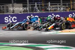 Esteban Ocon (FRA) Alpine F1 Team A521; Lewis Hamilton (GBR) Mercedes AMG F1 W12; and Max Verstappen (NLD) Red Bull Racing RB16B battle for the lead at the second race restart. 05.12.2021. Formula 1 World Championship, Rd 21, Saudi Arabian Grand Prix, Jeddah, Saudi Arabia, Race Day.