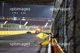 Double waved yellow flags shortly before the race was stopped after Sergio Perez (MEX) Red Bull Racing RB16B and Nikita Mazepin (RUS) Haas F1 Team VF-21 crashed. 05.12.2021. Formula 1 World Championship, Rd 21, Saudi Arabian Grand Prix, Jeddah, Saudi Arabia, Race Day.